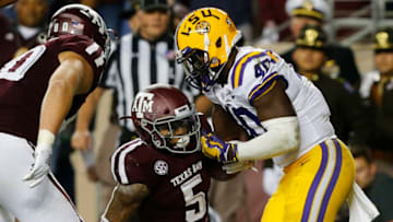 COLLEGE STATION, TEXAS - NOVEMBER 24: Trayveon Williams #5 of the Texas A&M Aggies scores on a 10 yard run as Grant Delpit #9 of the LSU Tigers and Devin White #40 of the LSU Tigers are unable to keep him out of the endzone during the first quarter at Kyle Field on November 24, 2018 in College Station, Texas. (Photo by Bob Levey/Getty Images)