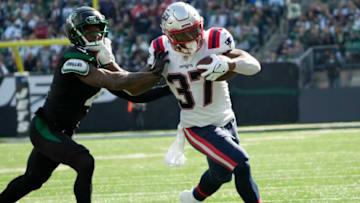 Patriots running back Damien Harris (37) tries to deflect Jets cornerback D.J. Reed (4). Sunday, October 30, 2022Jets Host Patriots