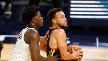 SAN FRANCISCO, CALIFORNIA - JANUARY 27: Stephen Curry #30 of the Golden State Warriors is guarded by Anthony Edwards #1 of the Minnesota Timberwolves at Chase Center on January 27, 2021 in San Francisco, California. NOTE TO USER: User expressly acknowledges and agrees that, by downloading and or using this photograph, User is consenting to the terms and conditions of the Getty Images License Agreement. (Photo by Ezra Shaw/Getty Images)