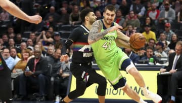 Juancho Hernangomez of the Minnesota Timberwolves drives to the basket against Jamal Murray of the Denver Nuggets. (Photo by Justin Tafoya/Getty Images)