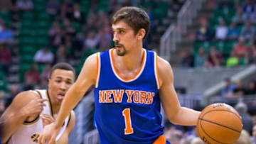 Mar 10, 2015; Salt Lake City, UT, USA; New York Knicks guard Alexey Shved (1) dribbles the ball in front of Utah Jazz guard Dante Exum (11) during the first quarter at EnergySolutions Arena. Mandatory Credit: Russ Isabella-USA TODAY Sports
