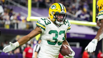 Dec 23, 2019; Minneapolis, Minnesota, USA; Green Bay Packers running back Aaron Jones (33) celebrates his touchdown during the fourth quarter against the Minnesota Vikings at U.S. Bank Stadium. Mandatory Credit: Brace Hemmelgarn-USA TODAY Sports