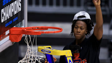 Mar 14, 2021; Indianapolis, Indiana, USA; Illinois Fighting Illini guard Ayo Dosunmu (11) celebrates as he cuts down a piece of the net after defeating the Ohio State Buckeyes at Lucas Oil Stadium. Mandatory Credit: Aaron Doster-USA TODAY Sports