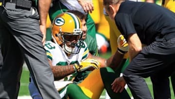 Sep 22, 2013; Cincinnati, OH, USA; Green Bay Packers tight end Jermichael Finley (88) is injured on the field against the Cincinnati Bengals at Paul Brown Stadium. Mandatory Credit: Pat Lovell-USA TODAY Sports