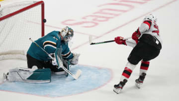New Jersey Devils defenseman Damon Severson (28) scores a goal against San Jose Sharks goaltender James Reimer (47) during a shootout at SAP Center at San Jose. Mandatory Credit: Darren Yamashita-USA TODAY Sports