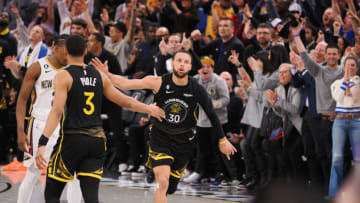 Mar 28, 2023; San Francisco, California, USA; Golden State Warriors guard Stephen Curry (30) celebrates with guard Jordan Poole (3) after scoring a three point basket against the New Orleans Pelicans during the third quarter at Chase Center. Mandatory Credit: Kelley L Cox-USA TODAY Sports