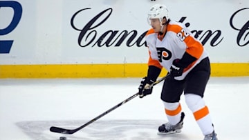 Nov 12, 2013; Ottawa, Ontario, CAN; Philadelphia Flyers defenseman Luke Schenn (22) controls the puck in the third period against the Ottawa Senators at the Canadian Tire Centre. The Flyers defeated the Senators 5-0. Mandatory Credit: Marc DesRosiers-USA TODAY Sports