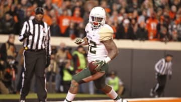 Nov 21, 2015; Stillwater, OK, USA; Baylor Bears running back Shock Linwood (32) scores a touchdown in the first quarter against the Oklahoma State Cowboys at Boone Pickens Stadium. Mandatory Credit: Tim Heitman-USA TODAY Sports