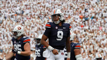 Auburn footballSep 2, 2023; Auburn, Alabama, USA; Auburn Tigers quarterback Robby Ashford (9) smiles after scoring a touchdown against the Massachusetts Minutemen during the second quarter at Jordan-Hare Stadium. Mandatory Credit: John Reed-USA TODAY Sports