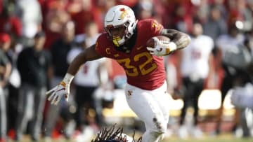 AMES, IA - OCTOBER 27: Running back David Montgomery #32 of the Iowa State Cyclones breaks away from linebacker Dakota Allen #40 of the Texas Tech Red Raiders while rising for yards in the second half of play at Jack Trice Stadium on October 27, 2018 in Ames, Iowa. The Iowa State Cyclones won 40-31 over the Texas Tech Red Raiders. (Photo by David Purdy/Getty Images)