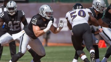 September 20, 2015; Oakland, CA, USA; Oakland Raiders inside linebacker Ben Heeney (51) blocks Baltimore Ravens outside linebacker Albert McClellan (50) during the first quarter at O.co Coliseum. The Raiders defeated the Ravens 37-33. Mandatory Credit: Kyle Terada-USA TODAY Sports