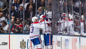 TORONTO, ON - OCTOBER 3: Artturi Lehkonen #62 celebrates a goal with Max Domi #13 of the Montreal Canadiens during the first period against the Toronto Maple Leafs at the Scotiabank Arena on October 3, 2018 in Toronto, Ontario, Canada. (Photo by Mark Blinch/NHLI via Getty Images)