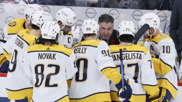 Nov 9, 2023; Winnipeg, Manitoba, CAN; Nashville Predators head coach Andrew Brunette talks with players during a time out in the third period against the Winnipeg Jets at Canada Life Centre. Mandatory Credit: James Carey Lauder-USA TODAY Sports