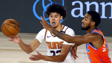 LAKE BUENA VISTA, FLORIDA - AUGUST 10: Cameron Johnson #23 of the Phoenix Suns is pressured by Terrance Ferguson #23 of the Oklahoma City Thunder during the third quarter at The Field House at ESPN Wide World Of Sports Complex on August 10, 2020 in Lake Buena Vista, Florida. NOTE TO USER: User expressly acknowledges and agrees that, by downloading and or using this photograph, User is consenting to the terms and conditions of the Getty Images License Agreement. (Photo by Mike Ehrmann/Getty Images)