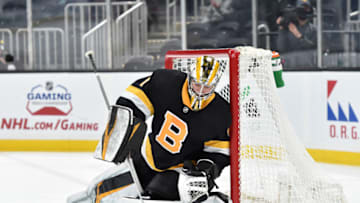 Apr 16, 2021; Boston, Massachusetts, USA; Boston Bruins goaltender Jeremy Swayman (1) handles the puck during the first period against the New York Islanders at TD Garden. Mandatory Credit: Bob DeChiara-USA TODAY Sports