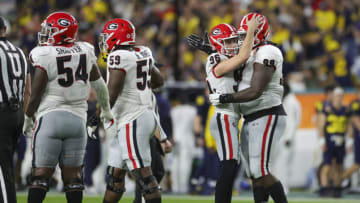 Jack Podlesny celebrates with Jordan Davis after scoring a field goal against Michigan. (Mandatory Credit: Sam Navarro-USA TODAY Sports)