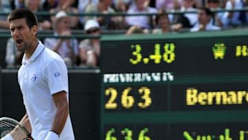 Serbian player Novak Djokovic reacts after a point over Australian player Bernard Tomic during the Wimbledon Tennis Championships at the All England Tennis Club, in southwest London on June 29, 2011. AFP PHOTO / BEN STANSALLRESTRICTED TO EDITORIAL USE (Photo credit should read BEN STANSALL/AFP via Getty Images)