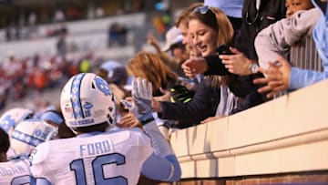 Oct 22, 2016; Charlottesville, VA, USA; North Carolina Tar Heels defensive back D.J. Ford (16) celebrates with fans after the Tar Heels game against the Virginia Cavaliers at Scott Stadium. The Tar Heels won 35-14. Mandatory Credit: Amber Searls-USA TODAY Sports