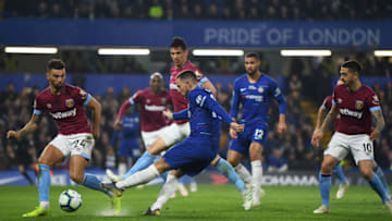 LONDON, ENGLAND - APRIL 08: Eden Hazard of Chelsea shoots past Ryan Fredericks of West Ham United during the Premier League match between Chelsea FC and West Ham United at Stamford Bridge on April 08, 2019 in London, United Kingdom. (Photo by Mike Hewitt/Getty Images)