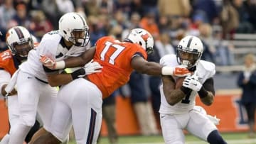 Nov 22, 2014; Champaign, IL, USA; Penn State Nittany Lions running back Bell Belton (1) is tackled by Illinois Fighitng Illini defensive end Jihad Ward (17) at Memorial Stadium. Illinois beat Penn State 16 to 14. Mandatory Credit: Mike Granse-USA TODAY Sports