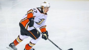 Feb 15, 2016; Calgary, Alberta, CAN; Anaheim Ducks defenseman Hampus Lindholm (47) controls the puck against the Calgary Flames during the third period at Scotiabank Saddledome. Anaheim Ducks won 6-4. Mandatory Credit: Sergei Belski-USA TODAY Sports