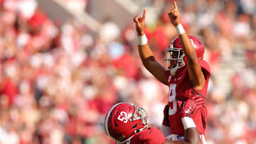 TUSCALOOSA, ALABAMA - SEPTEMBER 17: Bryce Young #9 of the Alabama Crimson Tide reacts with Tyler Booker #52 after passing for a touchdown against the Louisiana Monroe Warhawks during the second quarter at Bryant-Denny Stadium on September 17, 2022 in Tuscaloosa, Alabama. (Photo by Kevin C. Cox/Getty Images)