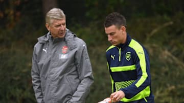 ST ALBANS, ENGLAND - SEPTEMBER 27: Manager Arsene Wenger of Arsenal talks to Laurent Koscielny during an Arsenal training session ahead of the Champions League Group A match between Arsenal and Basel at London Colney on September 27, 2016 in St Albans, England. (Photo by Mike Hewitt/Getty Images)
