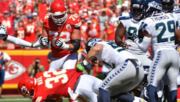 Aug 13, 2016; Kansas City, MO, USA; Kansas City Chiefs running back Spencer Ware (32) goes in for a touchdown as Seattle Seahawks center Joey Hunt (53) attempts the tackle during the first half at Arrowhead Stadium. Mandatory Credit: Denny Medley-USA TODAY Sports
