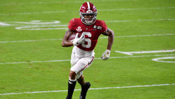 MIAMI GARDENS, FLORIDA - JANUARY 11: DeVonta Smith #6 of the Alabama Crimson Tide runs with the ball during the College Football Playoff National Championship football game against the Ohio State Buckeyes at Hard Rock Stadium on January 11, 2021 in Miami Gardens, Florida. The Alabama Crimson Tide defeated the Ohio State Buckeyes 52-24. (Photo by Alika Jenner/Getty Images)