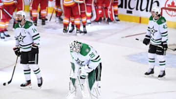 May 15, 2022; Calgary, Alberta, CAN; Dallas Stars forward Jamie Benn (14) and goalie Jake Oettinger (29) react to the overtime loss to the Calgary Flames in game seven of the first round of the 2022 Stanley Cup Playoffs at Scotiabank Saddledome. Mandatory Credit: Candice Ward-USA TODAY Sports