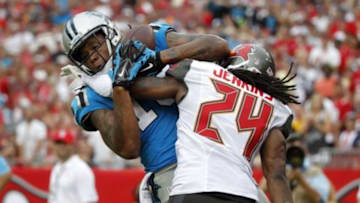 Sep 7, 2014; Tampa, FL, USA; Carolina Panthers wide receiver Kelvin Benjamin (13) catches the ball for a touchdown as Tampa Bay Buccaneers cornerback Mike Jenkins (24) as he was called for defensive pass interference during the second half at Raymond James Stadium. Carolina Panthers defeated the Tampa Bay Buccaneers 20-14. Mandatory Credit: Kim Klement-USA TODAY Sports