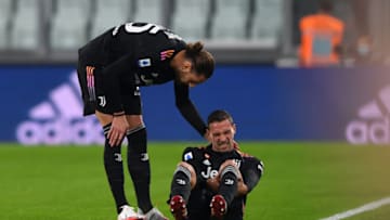 TURIN, ITALY - OCTOBER 27: Mattia de Sciglio of Juventus reacts in pain after injury consoled by teammate Adrien Rabiot of Juventus during the Serie A match between Juventus and US Sassuolo at Allianz Stadium on October 27, 2021 in Turin, Italy. (Photo by Chris Ricco/Getty Images)