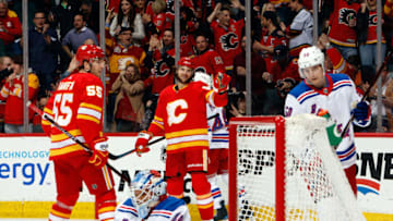 CALGARY, AB - MARCH 15: Michael Frolik #67 and Noah Hanifin #55 of the Calgary Flames celebrate a goal against the New York Rangers during an NHL game on March 15, 2019 at the Scotiabank Saddledome in Calgary, Alberta, Canada. (Photo by Gerry Thomas/NHLI via Getty Images)