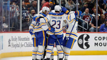 Dec 15, 2022; Denver, Colorado, USA; Buffalo Sabres defenseman Rasmus Dahlin (26) celebrates his goal with teammates in the second period against the Colorado Avalanche at Ball Arena. Mandatory Credit: Isaiah J. Downing-USA TODAY Sports