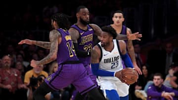 LOS ANGELES, CA - NOVEMBER 30: Wesley Matthews #23 of the Dallas Mavericks dribbles out of a double team in front of LeBron James #23 and Brandon Ingram #14 of the Los Angeles Lakers during a 114-103 Laker win at Staples Center on November 30, 2018 in Los Angeles, California. NOTE TO USER: User expressly acknowledges and agrees that, by downloading and or using this photograph, User is consenting to the terms and conditions of the Getty Images License Agreement. (Photo by Harry How/Getty Images)