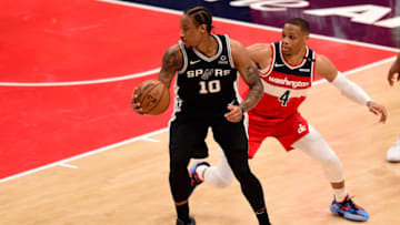 WASHINGTON, DC - APRIL 26: DeMar DeRozan #10 of the San Antonio Spurs dribbles the ball against Russell Westbrook #4 of the Washington Wizards in the second half at Capital One Arena on April 26, 2021 in Washington, DC. NOTE TO USER: User expressly acknowledges and agrees that, by downloading and or using this photograph, User is consenting to the terms and conditions of the Getty Images License Agreement. (Photo by Patrick McDermott/Getty Images)