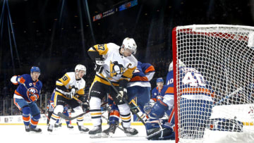 UNIONDALE, NEW YORK - DECEMBER 10: Sidney Crosby #87 of the Pittsburgh Penguins has his shot stopped by Robin Lehner #40 of the New York Islanders during the first period at Nassau Veterans Memorial Coliseum on December 10, 2018 in Uniondale, New York. (Photo by Mike Stobe/NHLI via Getty Images)