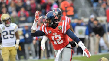 Dec 30, 2013; Nashville, TN, USA; Mississippi Rebels defensive back Tony Conner (12) celebrates sacking Georgia Tech Yellow Jackets quarterback Vad Lee (2) (not pictured) during the first half at LP Field. Mandatory Credit: Jim Brown-USA TODAY Sports