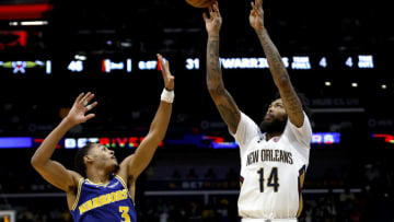 NEW ORLEANS, LOUISIANA - NOVEMBER 21: Brandon Ingram #14 of the New Orleans Pelicans shoots over Jordan Poole #3 of the Golden State Warriors during the third quarter of an NBA game at Smoothie King Center on November 21, 2022 in New Orleans, Louisiana. NOTE TO USER: User expressly acknowledges and agrees that, by downloading and or using this photograph, User is consenting to the terms and conditions of the Getty Images License Agreement. (Photo by Sean Gardner/Getty Images)