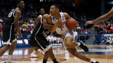 DAYTON, OH - MARCH 13: Carlik Jones #1 of the Radford Highlanders drives against Jashaun Agosto #3 of the LIU Brooklyn Blackbirds during the game at UD Arena on March 13, 2018 in Dayton, Ohio. (Photo by Kirk Irwin/Getty Images)