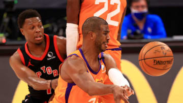 Chris Paul #3 of the Phoenix Suns passes away from Kyle Lowry #7 of the Toronto Raptors (Photo by Mike Ehrmann/Getty Images)
