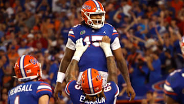Sep 3, 2022; Gainesville, Florida, USA; Florida Gators quarterback Anthony Richardson (15) is congratulated by offensive lineman Kingsley Eguakun (65) after he scored a touchdown against the Utah Utes during the second quarter at Steve Spurrier-Florida Field. Mandatory Credit: Kim Klement-USA TODAY Sports