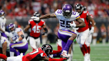 ATLANTA, GA - DECEMBER 03: Latavius Murray #25 of the Minnesota Vikings avoids the tackle by Damontae Kazee #27 of the Atlanta Falcons on a long run during the first half at Mercedes-Benz Stadium on December 3, 2017 in Atlanta, Georgia. (Photo by Kevin C. Cox/Getty Images)