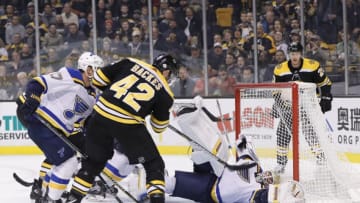 BOSTON, MA - FEBRUARY 01: Boston Bruins center David Backes (42) fans on a shot with St. Louis Blues goalie Jake Allen (34) down on the ice during a game between the Boston Bruins and the St. Louis Blues on February 1, 2018, at TD Garden in Boston, Massachusetts. The Bruins defeated the Blues 3-1. (Photo by Fred Kfoury III/Icon Sportswire via Getty Images)