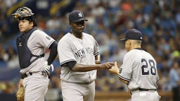 May 28, 2016; St. Petersburg, FL, USA; New York Yankees starting pitcher Michael Pineda (35) is taken out of the game by manager Joe Girardi (28) during the fourth inning against the Tampa Bay Rays at Tropicana Field. Mandatory Credit: Kim Klement-USA TODAY Sports
