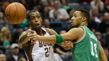 Feb 7, 2015; Milwaukee, WI, USA; Milwaukee Bucks guard Khris Middleton (22) gets a pass away from Boston Celtics guard Evan Turner (11) in the first quarter at BMO Harris Bradley Center. Mandatory Credit: Benny Sieu-USA TODAY Sports