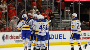 Nov 30, 2022; Detroit, Michigan, USA; Buffalo Sabres right wing Jack Quinn (22) receives congratulations from teammates after scoring a shoot out goal against the Detroit Red Wings at Little Caesars Arena. Mandatory Credit: Rick Osentoski-USA TODAY Sports