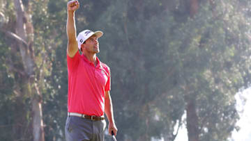 PACIFIC PALISADES, CALIFORNIA - FEBRUARY 16: Adam Scott of Australia celebrates making a par on the 18th green to win the Genesis Invitational on February 16, 2020 in Pacific Palisades, California. (Photo by Chris Trotman/Getty Images)