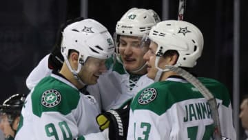 NEW YORK, NY - JANUARY 03: Valeri Nichushkin #43 of the Dallas Stars scores a third period goal against the New York Islanders and is joined by Jason Spezza #90 (l) and Mattias Janmark #13 (r) at the Barclays Center on January 3, 2016 in the Brooklyn borough of New York City. The Islanders defeated the Stars 6-5. (Photo by Bruce Bennett/Getty Images)