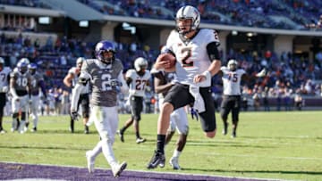 FORT WORTH, TX - NOVEMBER 19: Oklahoma State Cowboys quarterback Mason Rudolph (#2) scores a touchdown during the Big 12 college football game between the TCU Horned Frogs and the Oklahoma State Cowboys on November 19, 2016, at Amon G. Carter Stadium in Fort Worth, TX. Oklahoma State won the game 31-6. (Photo by Matthew Visinsky/Icon Sportswire via Getty Images).